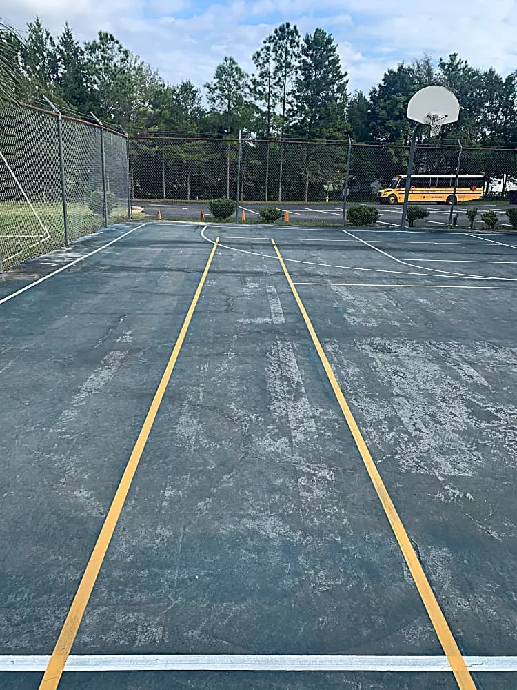 Basketball court before resurfacing