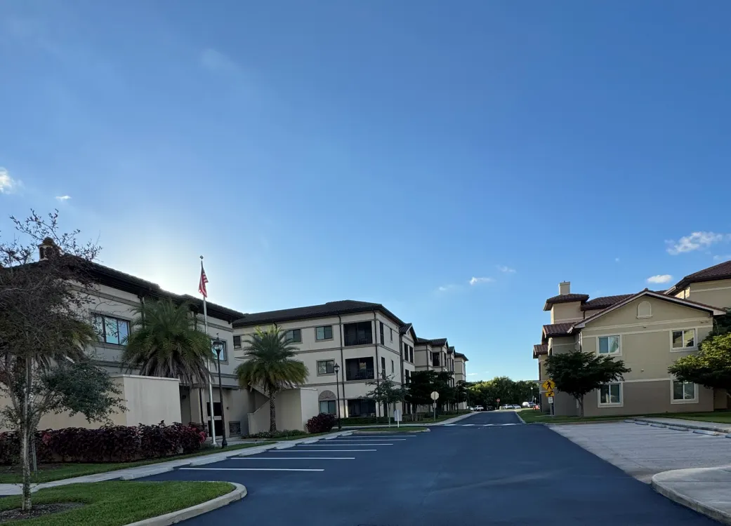 Apartment buildings with newly sealcoated roadway