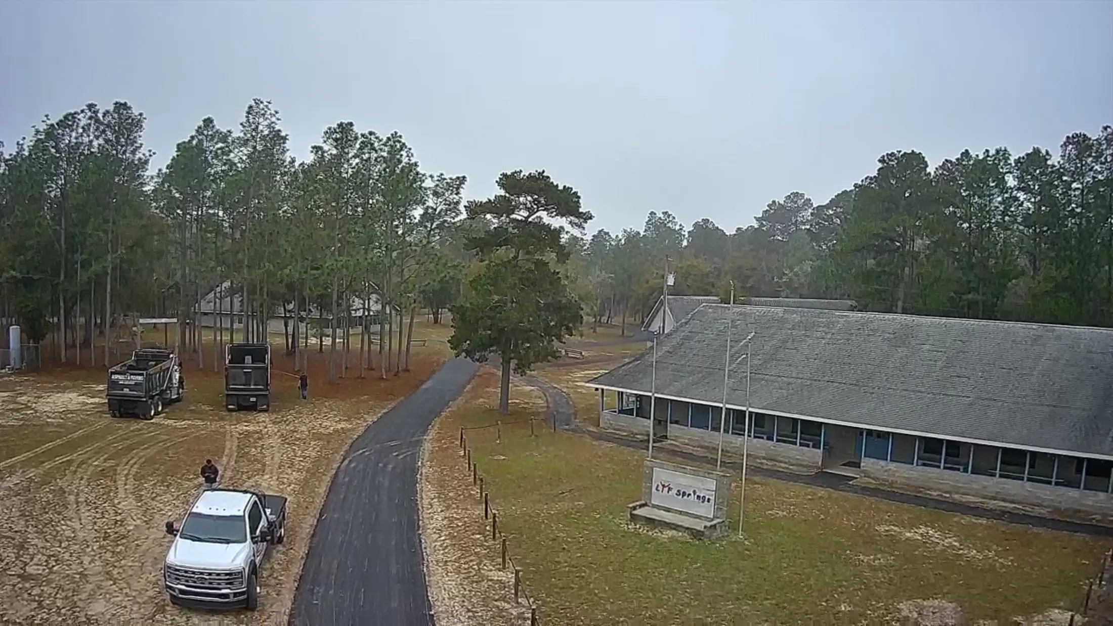 Aerial view of completed asphalt driveways at a Florida residential property