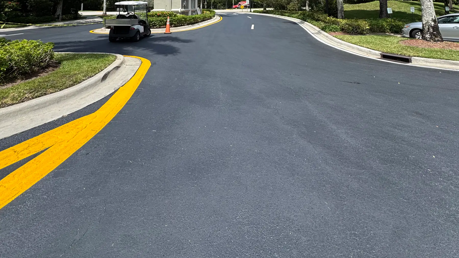 Completed asphalt roadway with fresh centerline markings